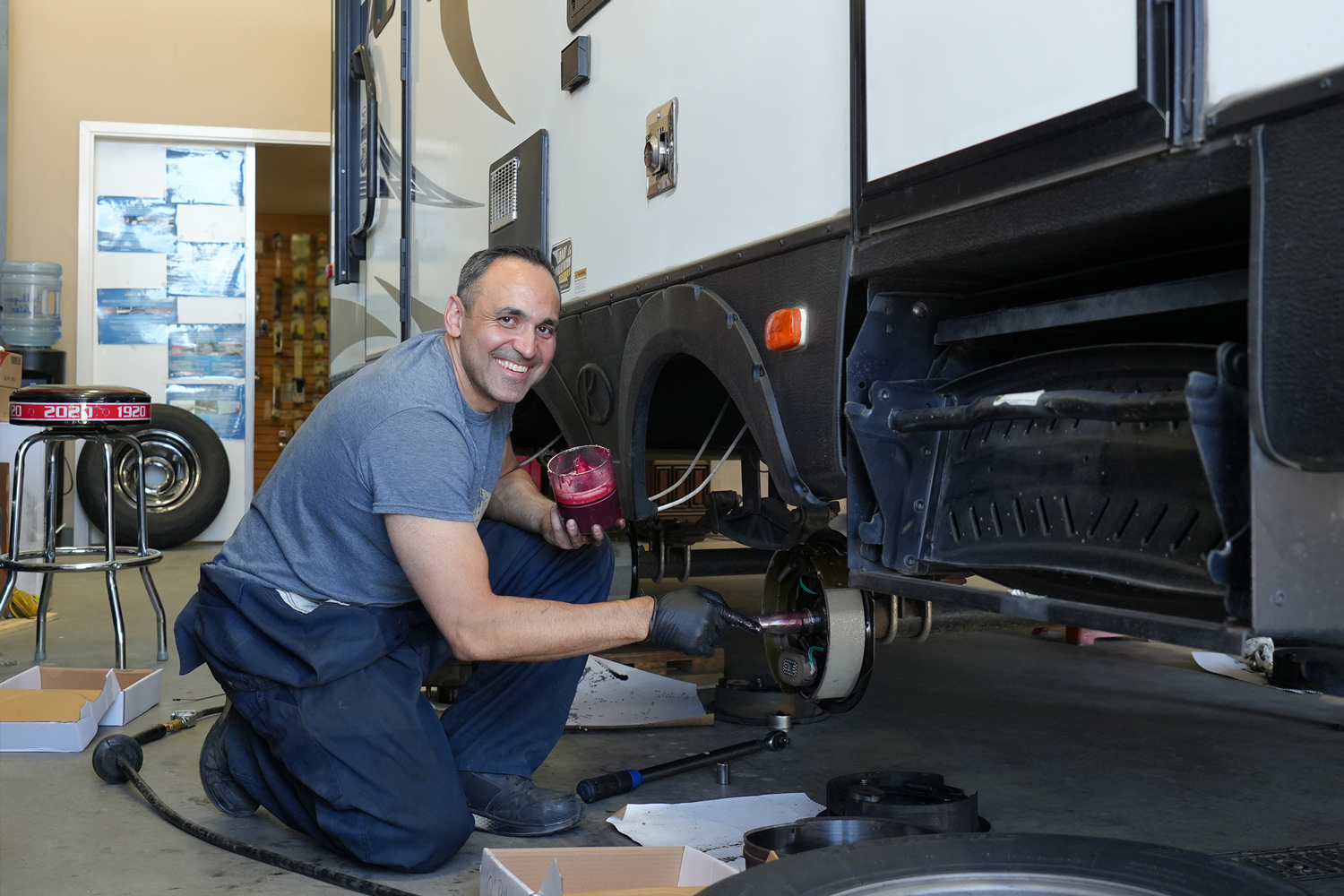 RV service technician working on a vehicle